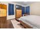 Cozy bedroom featuring hardwood floors, a dresser, and a comfortable bed, offering a relaxing retreat at 5101 13Th S Ave, Gulfport, FL 33707