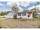 Property exterior with a three car garage and yard, offering ample parking space and convenience at 5101 13Th S Ave, Gulfport, FL 33707