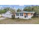 Well-maintained home exterior featuring a three car garage and front entrance, offering classic curb appeal at 5101 13Th S Ave, Gulfport, FL 33707