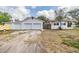 Exterior shot of property featuring multiple garages and driveway offering ample parking at 5101 13Th S Ave, Gulfport, FL 33707