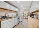 Functional kitchen has white cabinets, butcher block countertops, and lots of natural light at 5101 13Th S Ave, Gulfport, FL 33707