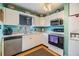 Well-equipped kitchen featuring white cabinets, stainless steel appliances, and ample counter space at 5101 13Th S Ave, Gulfport, FL 33707