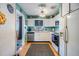 Functional kitchen featuring white cabinets, stainless steel appliances, and plenty of natural light at 5101 13Th S Ave, Gulfport, FL 33707