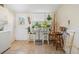 Bright laundry room with tile floors, a table with plants and hanging planters, and access to the backyard at 5101 13Th S Ave, Gulfport, FL 33707