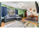 Inviting living room featuring a large window, comfortable seating, and hardwood floors at 5101 13Th S Ave, Gulfport, FL 33707