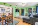 Bright living room with hardwood floors open to kitchen, comfortable seating, and plenty of natural light at 5101 13Th S Ave, Gulfport, FL 33707