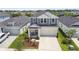 Well maintained two-story home with a two-car garage and a nicely landscaped front yard at 5437 Del Coronado Dr, Apollo Beach, FL 33572