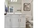 Bright bathroom with white vanity and framed art, blending functionality with style at 5437 Del Coronado Dr, Apollo Beach, FL 33572