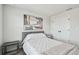 Comfortable bedroom with a cozy bed, mirrored nightstand, and artistic wall decor at 5437 Del Coronado Dr, Apollo Beach, FL 33572