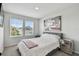 Bright bedroom with neutral tones, featuring large windows and modern decor at 5437 Del Coronado Dr, Apollo Beach, FL 33572