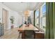 Dining room area features modern lighting, hardwood floors and open concept design at 5437 Del Coronado Dr, Apollo Beach, FL 33572