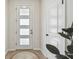 Bright entryway with a modern front door, wood flooring, and stylish interior door at 5437 Del Coronado Dr, Apollo Beach, FL 33572