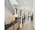 Hallway with wood floor leads to open floor plan showcasing adjacent dining and living space at 5437 Del Coronado Dr, Apollo Beach, FL 33572