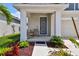 Welcoming front porch with comfortable seating and a stylish front door, perfect for relaxing at 5437 Del Coronado Dr, Apollo Beach, FL 33572
