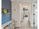 Hallway with a playful basketball hoop next to the bonus room with a reading nook at 5437 Del Coronado Dr, Apollo Beach, FL 33572