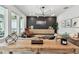 Bright and airy living room featuring a sleek accent wall and modern furnishings at 5437 Del Coronado Dr, Apollo Beach, FL 33572