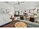Bright living room with modern lighting and an open view to the dining area at 5437 Del Coronado Dr, Apollo Beach, FL 33572