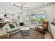 Bright living room with open kitchen view and access to outdoor pool area at 5437 Del Coronado Dr, Apollo Beach, FL 33572
