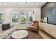 Cozy living area with a view of the pool and a stylish accent wall at 5437 Del Coronado Dr, Apollo Beach, FL 33572