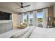 Spacious main bedroom features abundant natural light, ceiling fan, sitting area, and en suite bathroom at 5437 Del Coronado Dr, Apollo Beach, FL 33572