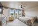 Comfortable main bedroom featuring bright windows, neutral tones, and a ceiling fan at 5437 Del Coronado Dr, Apollo Beach, FL 33572