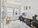 Bright home office featuring a large desk, modern decor, and ample natural light at 5437 Del Coronado Dr, Apollo Beach, FL 33572
