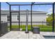 Enclosed outdoor shower in screened pool area with tiled floor and modern fixtures; a luxurious addition at 5437 Del Coronado Dr, Apollo Beach, FL 33572