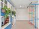 Inviting playroom featuring a whimsical playhouse and gymnastic ladder for active play at 5437 Del Coronado Dr, Apollo Beach, FL 33572