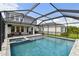 The backyard offers a pool, spa, patio, and outdoor seating area within a screened-in enclosure at 5437 Del Coronado Dr, Apollo Beach, FL 33572