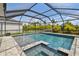Enjoy the beautiful screened-in pool with an attached spa and plenty of space for outdoor lounging at 5437 Del Coronado Dr, Apollo Beach, FL 33572