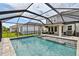 Backyard with pool, hot tub, patio, outdoor seating area, and screened-in enclosure for leisure and relaxation at 5437 Del Coronado Dr, Apollo Beach, FL 33572