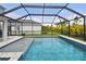 Enjoy the beautiful screened-in pool with an attached spa and plenty of space for outdoor lounging at 5437 Del Coronado Dr, Apollo Beach, FL 33572
