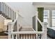 Staircase landing features railing with a view of dining room at 5437 Del Coronado Dr, Apollo Beach, FL 33572