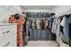 Organized walk-in closet with shelving and drawers, offering plenty of storage space for clothes and accessories at 5437 Del Coronado Dr, Apollo Beach, FL 33572