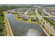 An aerial view of homes with pools and a lake nearby, showcasing an active community at 5477 Wayfarer Ave, Apollo Beach, FL 33572