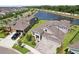 Beautiful aerial view of home, landscaped yard and a scenic pond at 5477 Wayfarer Ave, Apollo Beach, FL 33572