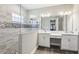 Bright bathroom features double vanities, glass shower and stylish tile accents at 5477 Wayfarer Ave, Apollo Beach, FL 33572