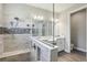 Bright bathroom features double vanities, glass shower and stylish tile accents at 5477 Wayfarer Ave, Apollo Beach, FL 33572