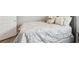 Close up of a cozy bed with decorative pillows and a luxurious bedspread at 5477 Wayfarer Ave, Apollo Beach, FL 33572