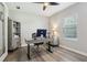 Bright office space with stylish furnishings, wood-look flooring, and a large window for natural light at 5477 Wayfarer Ave, Apollo Beach, FL 33572