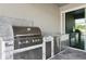 Outdoor kitchen area featuring a built-in grill, drawers, and countertop space at 5477 Wayfarer Ave, Apollo Beach, FL 33572