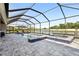 Enclosed patio pool and jacuzzi overlooking a lake view at 5477 Wayfarer Ave, Apollo Beach, FL 33572
