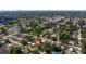 Aerial view of a residential area featuring lush greenery and cozy homes at 5932 Mckee Lake N Dr, St Petersburg, FL 33709