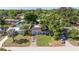 Charming home with inviting curb appeal, lush landscaping, and a well-manicured lawn at 5932 Mckee Lake N Dr, St Petersburg, FL 33709