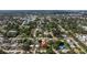 Aerial view of neighborhood, lush landscapes, and well-maintained homes at 5932 Mckee Lake N Dr, St Petersburg, FL 33709