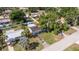 Aerial view of a home showcasing a lush backyard and convenient storage shed at 5932 Mckee Lake N Dr, St Petersburg, FL 33709