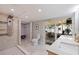 Modern bathroom featuring a large shower, double vanity and access to sunroom at 5932 Mckee Lake N Dr, St Petersburg, FL 33709