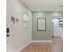 Spacious entryway with wood floors, white walls, and natural light from a window at 5932 Mckee Lake N Dr, St Petersburg, FL 33709