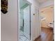 Hallway featuring a bathroom and bedroom at 5932 Mckee Lake N Dr, St Petersburg, FL 33709