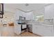 Modern kitchen with white cabinets, stainless steel appliances, and granite countertops at 5932 Mckee Lake N Dr, St Petersburg, FL 33709